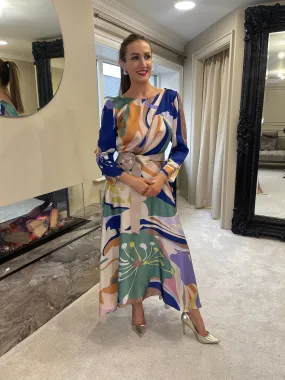 Certainly! An optimized title for the e-commerce product could be:

Elegant Matilde Cano Dress 2201ML - Purple & Green Color Block Gown

This title includes descriptive modifiers that help convey key features of the product, which can attract potential buyers and improve searchability.