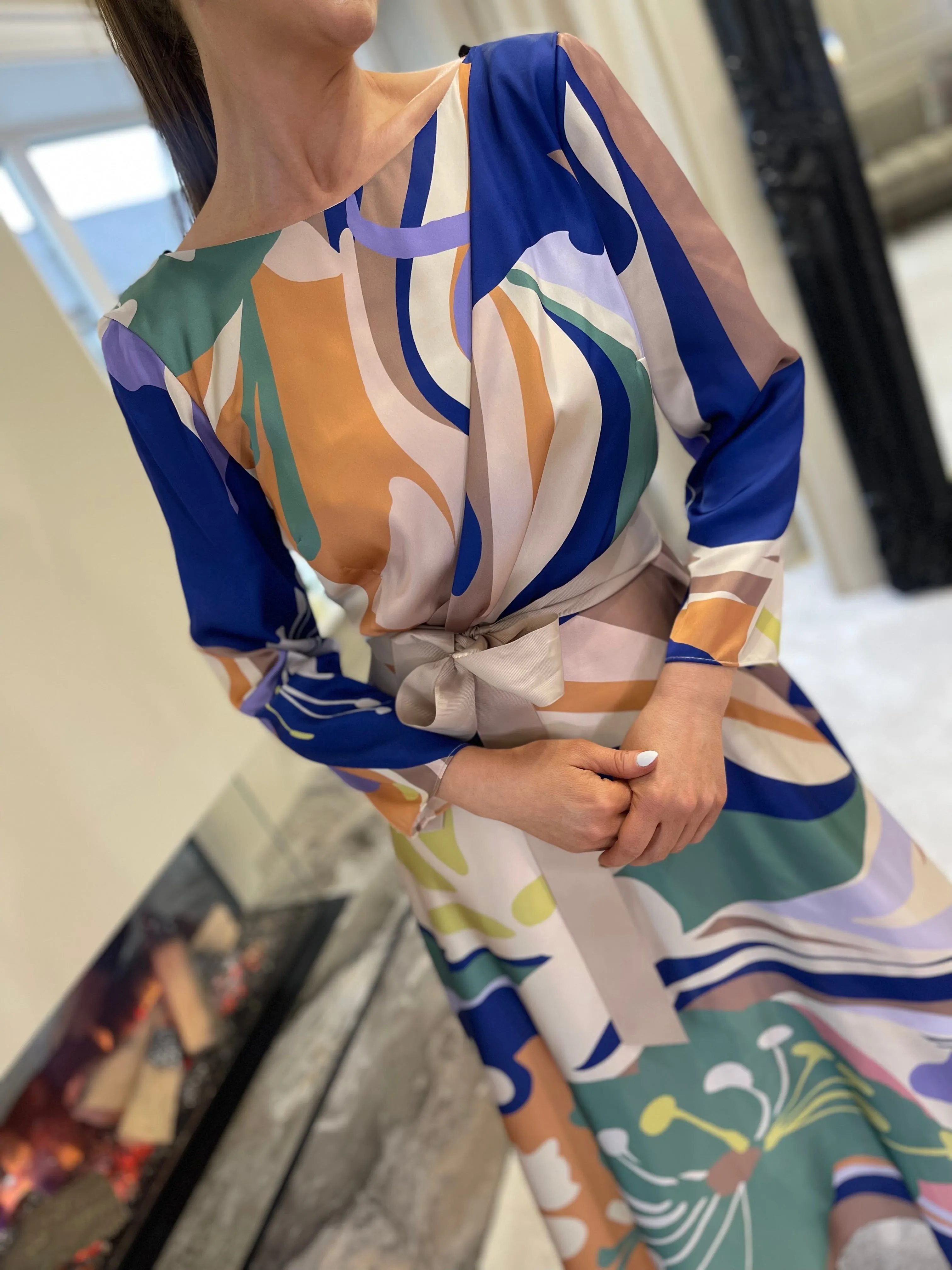 Certainly! An optimized title for the e-commerce product could be:

Elegant Matilde Cano Dress 2201ML - Purple & Green Color Block Gown

This title includes descriptive modifiers that help convey key features of the product, which can attract potential buyers and improve searchability.